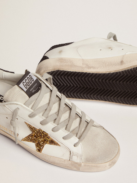 Golden Goose Super-Star In Gold Glitter Star And Black Glitter Heel tab Golden Goose Super-Star In Gold Glitter Star And Black Glitter Heel tab