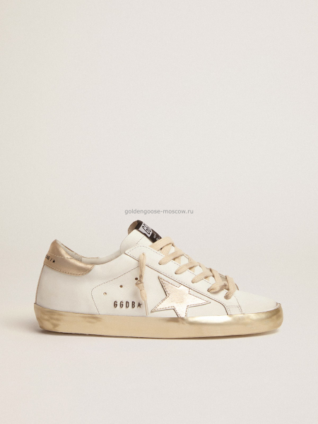 Golden Goose Super-Star with gold sparkle foxing and metal stud lettering